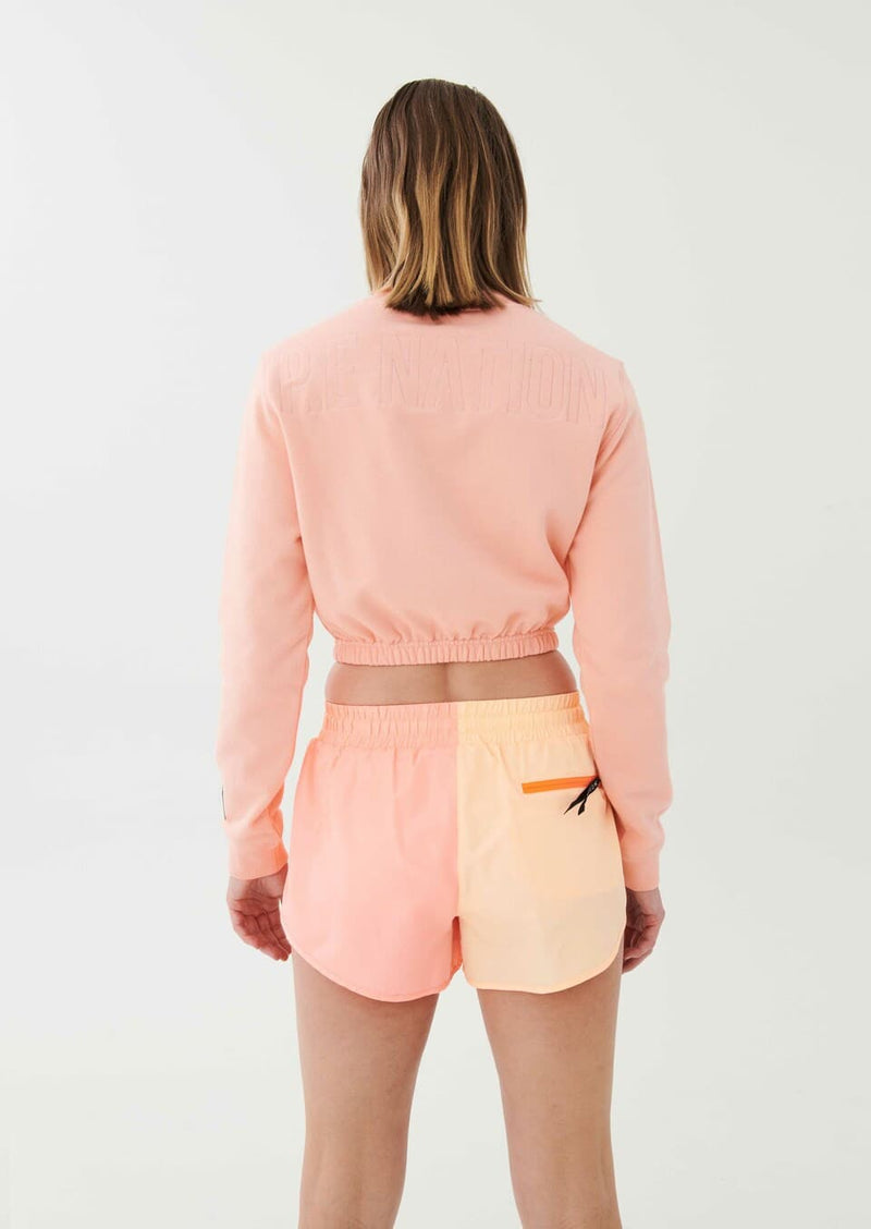 CLUBHOUSE SWEATER IN SOFT CORAL.